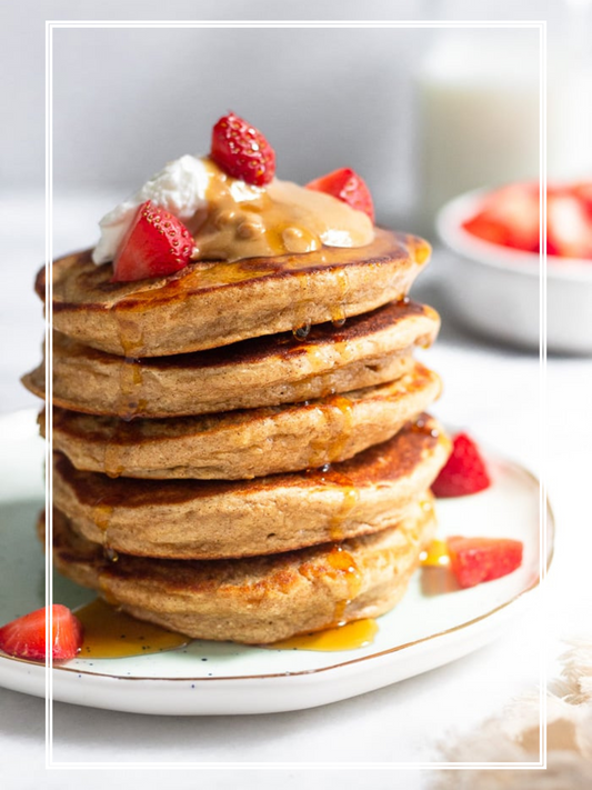 Banana Protein Pancakes with Peanut Butter Sauce and Mixed Berries